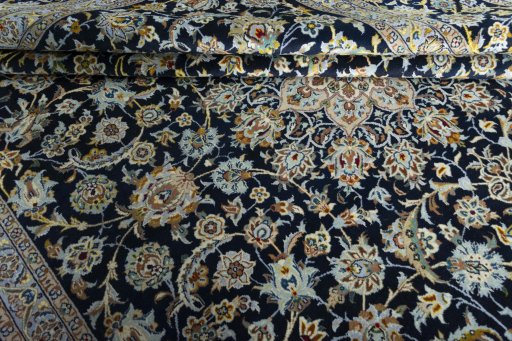 Close-up detail of 2000s Kashan rug from Iran / Persia showing Wool weave