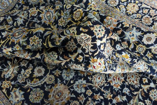 Surface texture of 2000s Kashan rug with natural Wool and intricate pattern