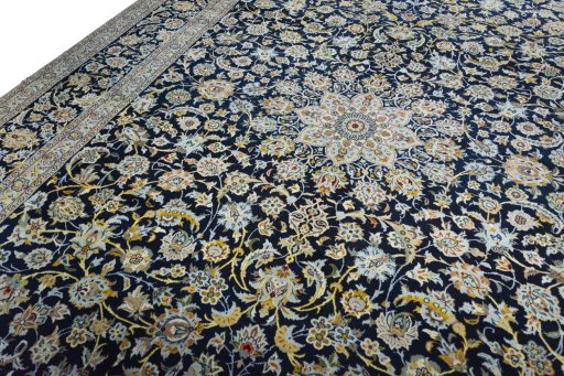 Backside of handmade 2000s Kashan rug showing knot structure and weave density