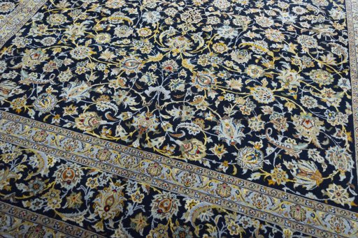 Close-up detail of 2000s Kashan rug from Iran / Persia showing Wool weave