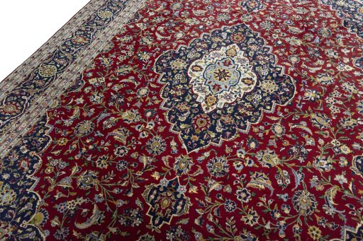 Backside of handmade New Kashan rug showing knot structure and weave density