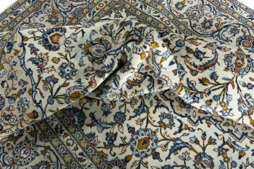 Surface texture of 2000s Kashan rug with natural Wool and intricate pattern