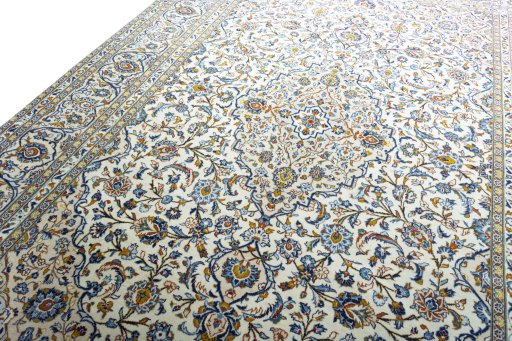 Backside of handmade 2000s Kashan rug showing knot structure and weave density