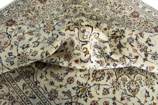 Surface texture of 2000s Kashan rug with natural Wool and intricate pattern