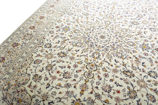 Backside of handmade 2000s Kashan rug showing knot structure and weave density