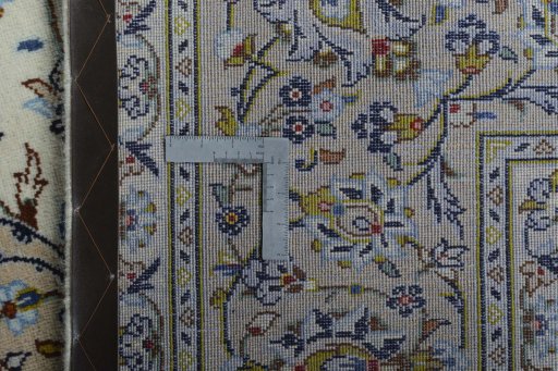 Backside of handmade 2000s Kashan rug showing knot structure and weave density
