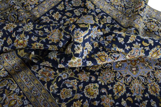 Surface texture of 2000s Kashan rug with natural Wool and intricate pattern