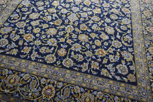 Close-up detail of 2000s Kashan rug from Iran / Persia showing Wool weave