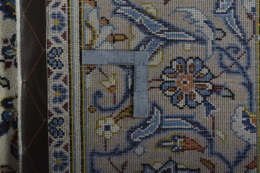 Backside of handmade 2000s Kashan rug showing knot structure and weave density