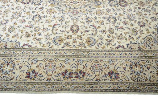 Corner detail of 2000s Kashan rug showing border pattern and Wool pile