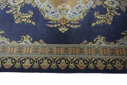 Corner detail of 2000s Kashan rug showing border pattern and Wool pile