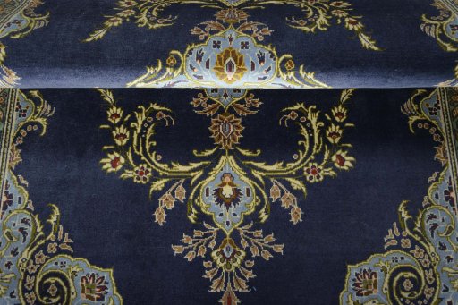 Close-up detail of 2000s Kashan rug from Iran / Persia showing Wool weave
