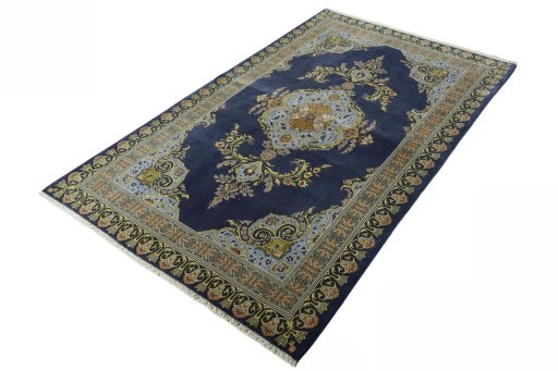 Corner detail of 2000s Kashan rug showing border pattern and Wool pile