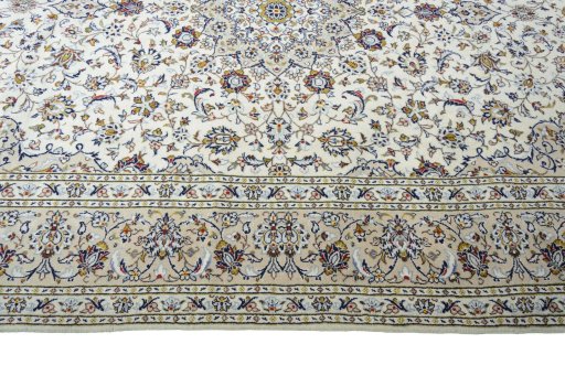 Corner detail of 2000s Kashan rug showing border pattern and Wool pile