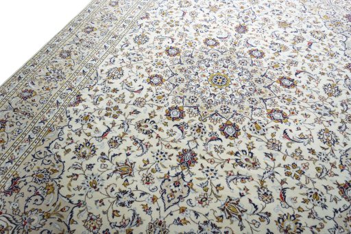 Backside of handmade 2000s Kashan rug showing knot structure and weave density
