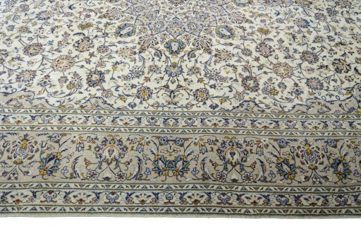 Corner detail of 2000s Kashan rug showing border pattern and Wool pile