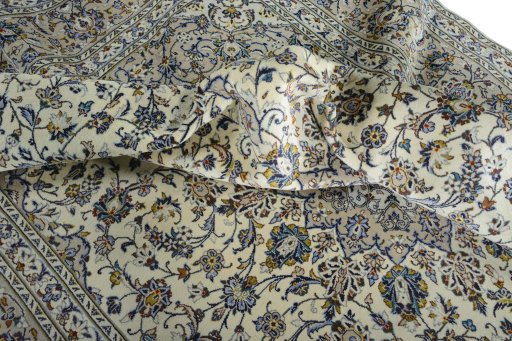 Surface texture of 2000s Kashan rug with natural Wool and intricate pattern