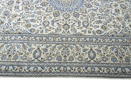 Corner detail of New Kashan rug showing border pattern and Wool pile