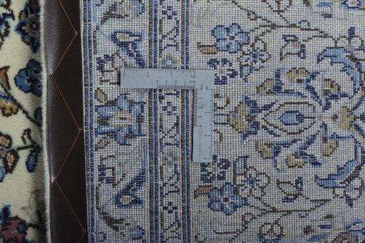 Backside of handmade New Kashan rug showing knot structure and weave density