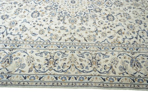 Corner detail of 2000s Kashan rug showing border pattern and Wool pile