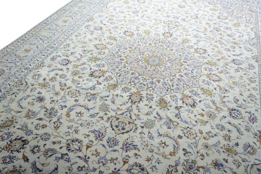 Backside of handmade 2000s Kashan rug showing knot structure and weave density