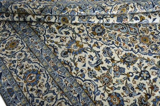 Close-up detail of 2000s Kashan rug from Iran / Persia showing Wool weave