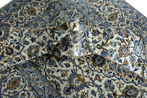 Surface texture of 2000s Kashan rug with natural Wool and intricate pattern