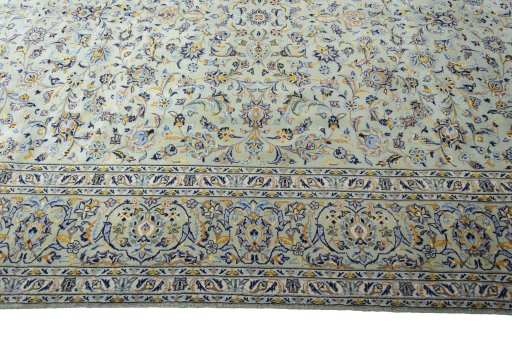 Corner detail of 2000s Kashan rug showing border pattern and Wool pile