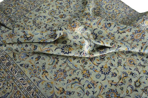 Surface texture of 2000s Kashan rug with natural Wool and intricate pattern