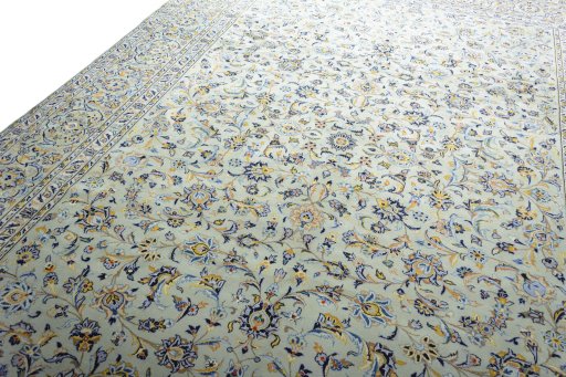 Backside of handmade 2000s Kashan rug showing knot structure and weave density