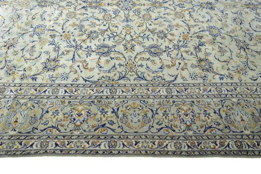 Corner detail of 2000s Kashan rug showing border pattern and Wool pile
