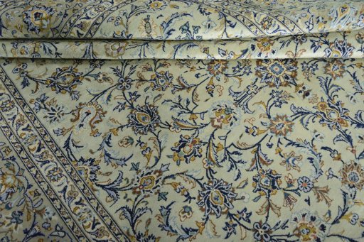 Close-up detail of 2000s Kashan rug from Iran / Persia showing Wool weave