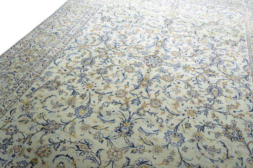 Backside of handmade 2000s Kashan rug showing knot structure and weave density