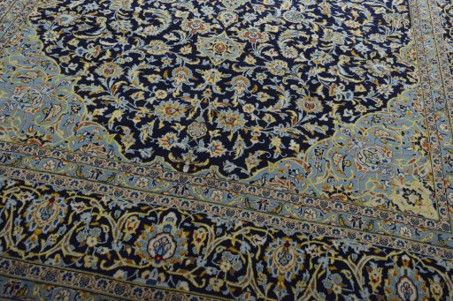 Close-up detail of 2000s Kashan rug from Iran / Persia showing Wool weave