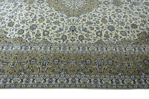 Corner detail of 2000s Kashan rug showing border pattern and Wool pile