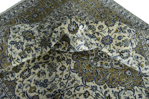 Surface texture of 2000s Kashan rug with natural Wool and intricate pattern