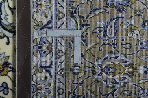 Backside of handmade 2000s Kashan rug showing knot structure and weave density