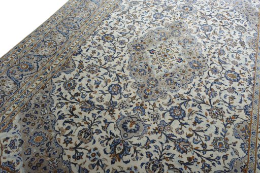 Backside of handmade 2000s Kashan rug showing knot structure and weave density