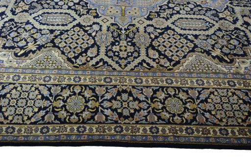 Corner detail of 2000s Kashan rug showing border pattern and Wool pile