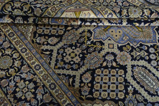 Close-up detail of 2000s Kashan rug from Iran / Persia showing Wool weave