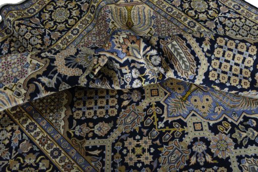 Surface texture of 2000s Kashan rug with natural Wool and intricate pattern