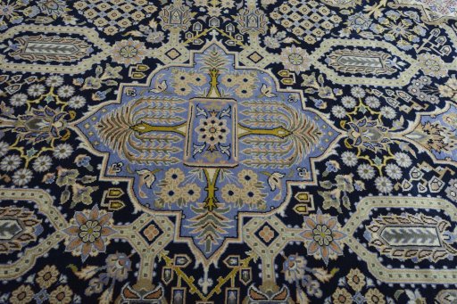 Central medallion detail of 2000s Kashan rug from Iran / Persia