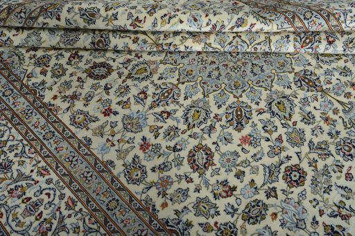Close-up detail of 2000s Kashan rug from Iran / Persia showing Wool weave