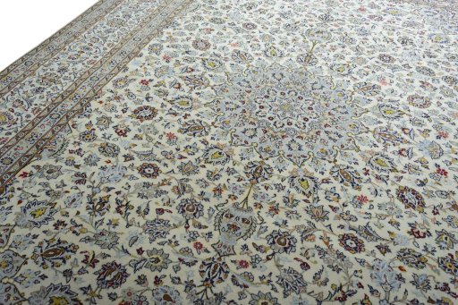 Backside of handmade 2000s Kashan rug showing knot structure and weave density