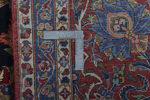 Backside of handmade 1930s Kashan rug showing knot structure and weave density