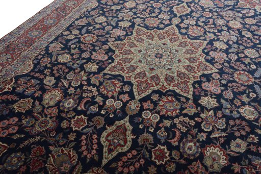 Backside of handmade 1930s Kashan rug showing knot structure and weave density
