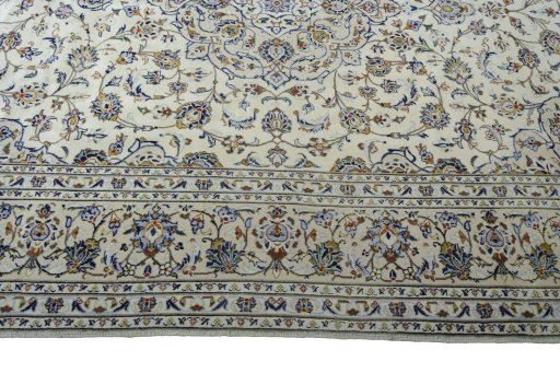 Corner detail of 2000s Kashan rug showing border pattern and Wool pile