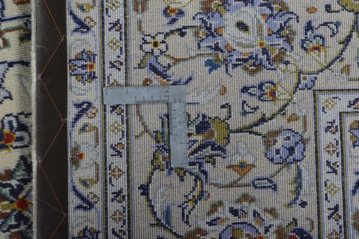 Backside of handmade 2000s Kashan rug showing knot structure and weave density