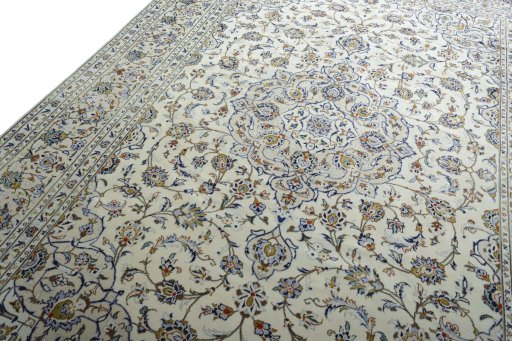 Backside of handmade 2000s Kashan rug showing knot structure and weave density