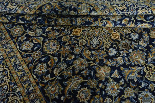 Close-up detail of 2000s Kashan rug from Iran / Persia showing Wool weave